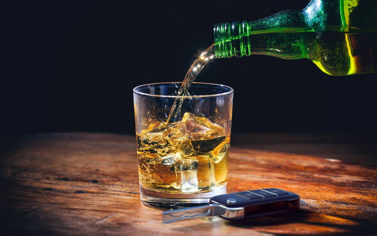 dui elements, keys and a glass of whiskey